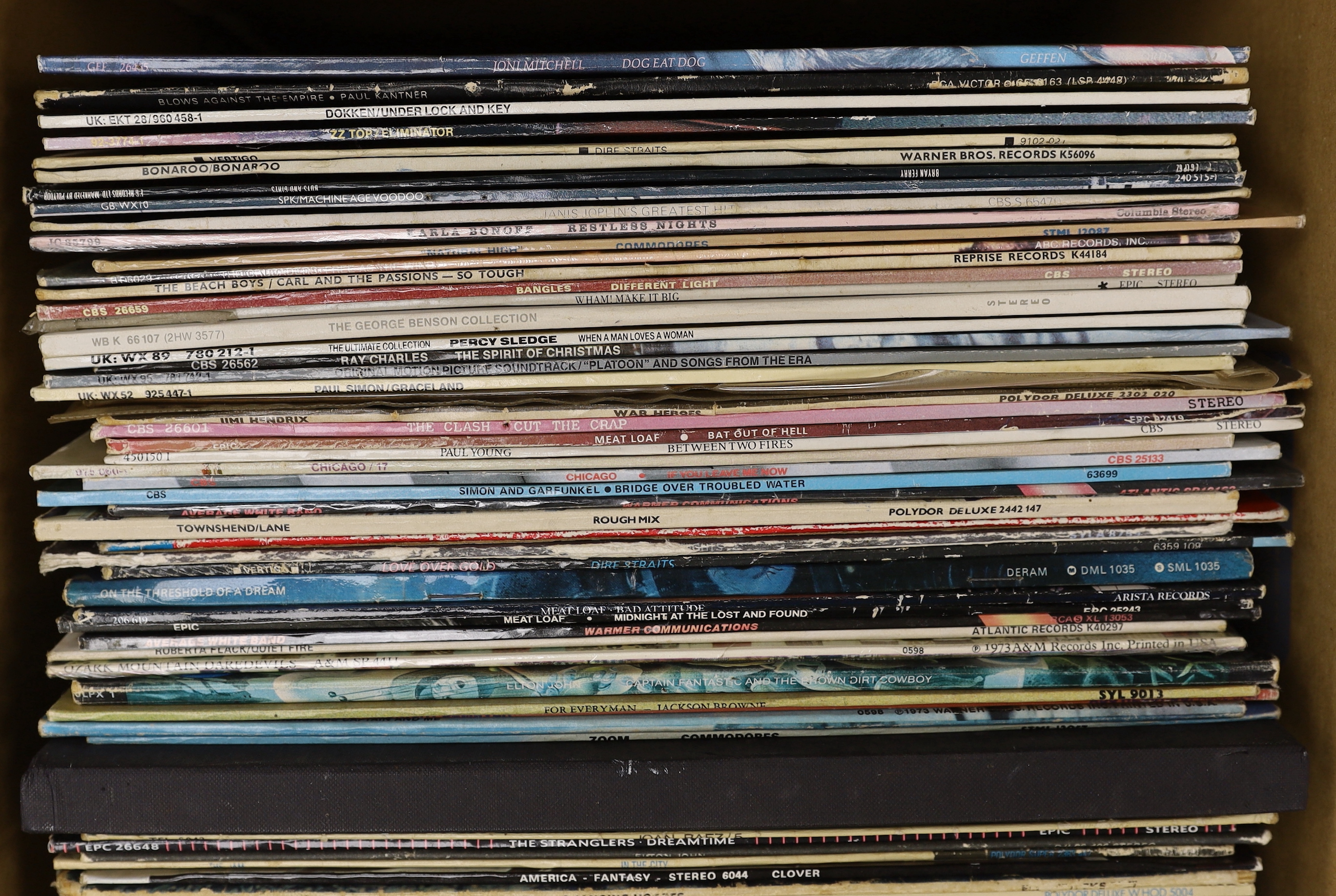 Sixty-nine LP record albums, by artists including; The Beach Boys, George Benson, Paul Simon, The Clash, Meat Loaf, Average White Band, Dire Straits, Elton John, ELO, Eagles, Joe Cocker, etc.